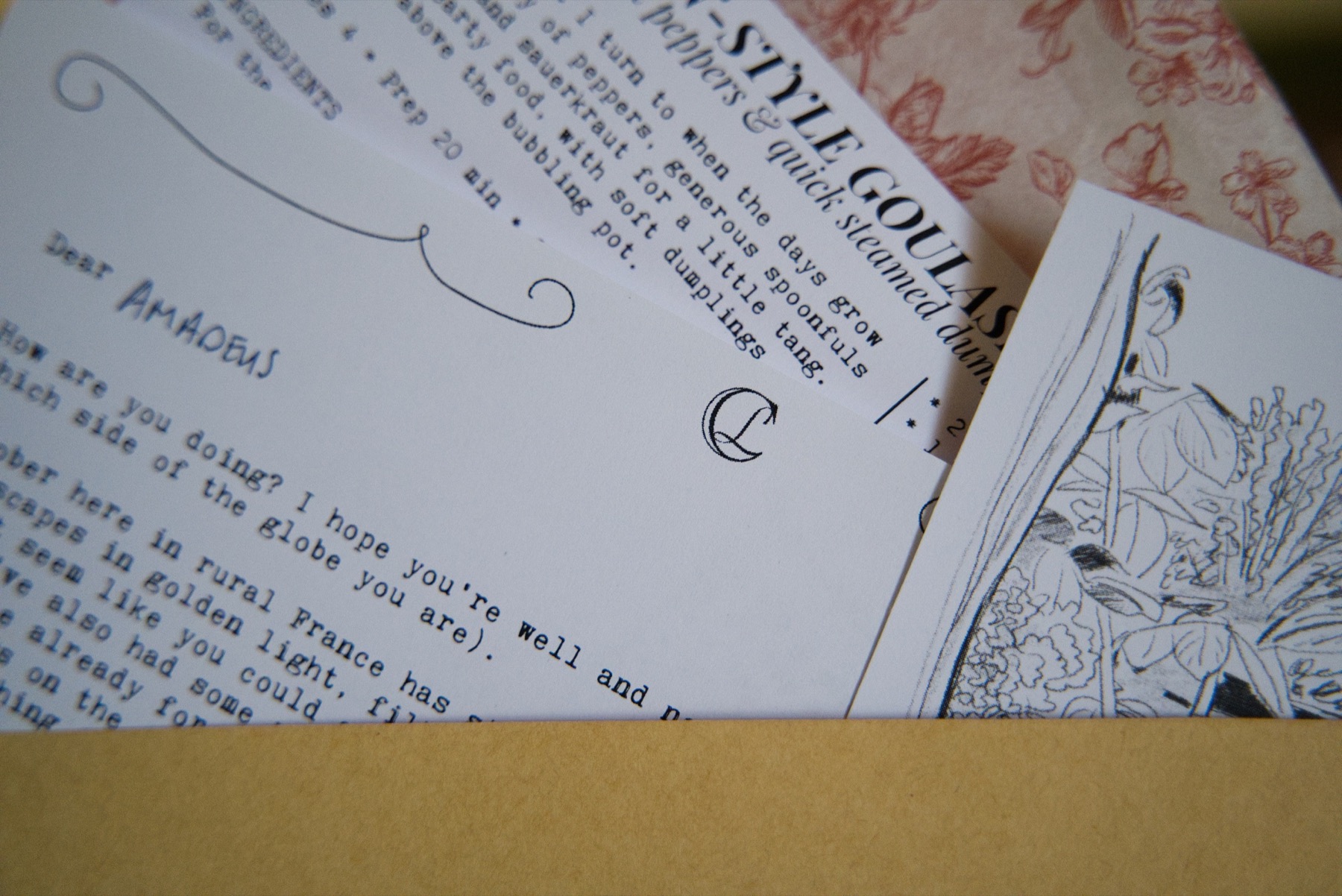 A close view of the typewritten letter, seasonal recipe and château sketch